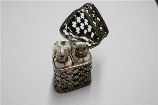 A late Victorian silver aide memoire (ex chatelaine), a childs rattle and white metal scent casket.